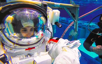 Nora Al Matrooshi completes tasks underwater during her spacewalk training