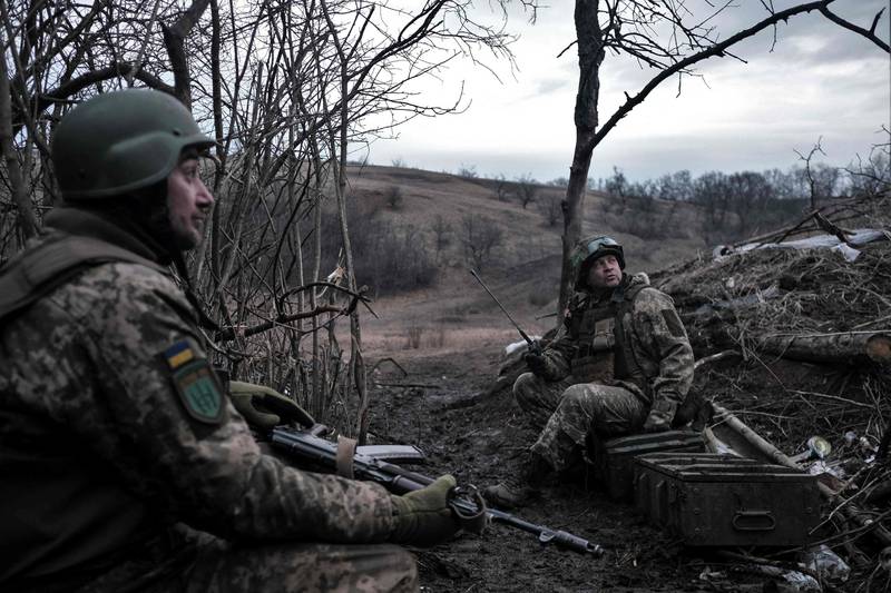 Ukrainian volunteer soldiers hold their positions at the front line near Bakhmut. AFP