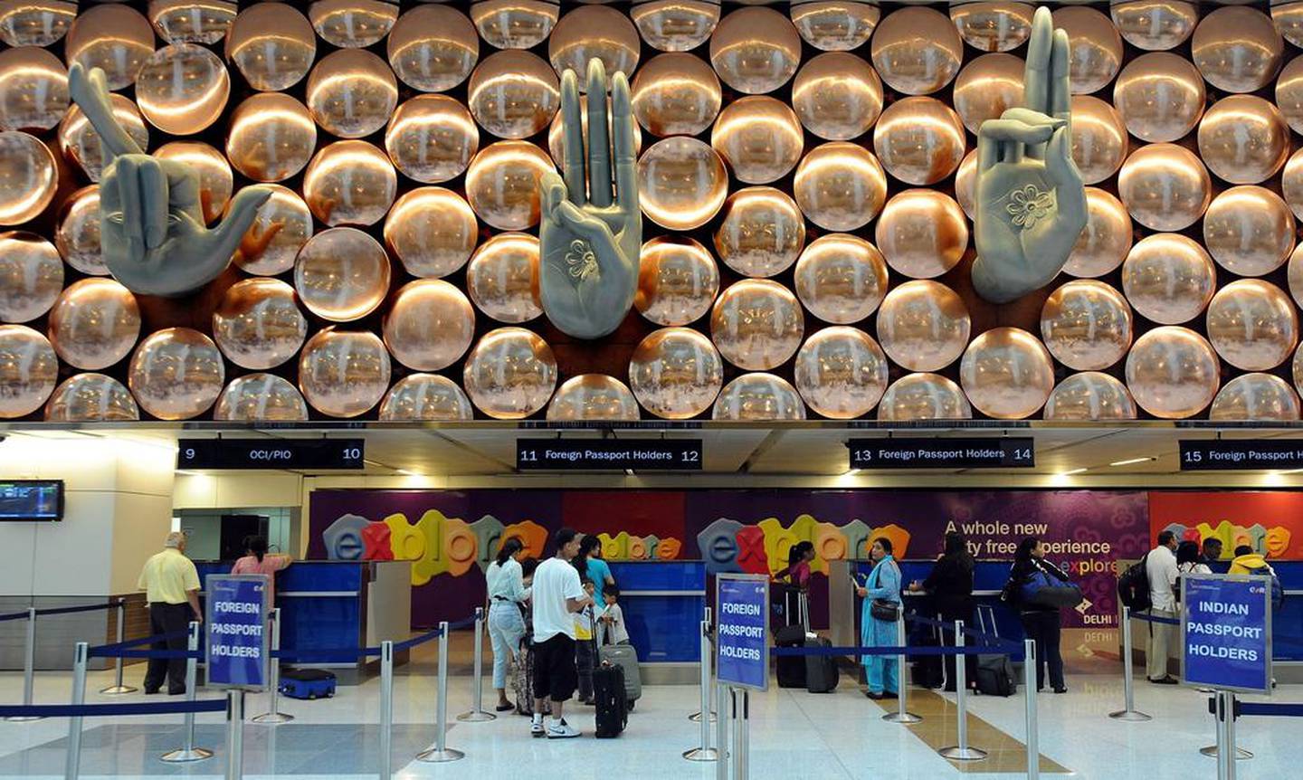 Passengers pass through immigration counters at Terminal 3 of Indira Gandhi International Airport in New Delhi. AFP