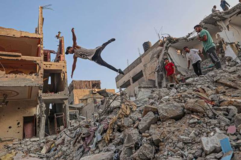 Palestinian youths practise parkour amid the rubble of buildings destroyed by Israeli air strikes in the latest round of fighting between Israel and Palestinian militants, in Rafah in the southern Gaza Strip. All photos: AFP
