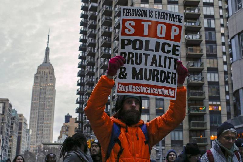 The Empire State Building is seen in the background while people march against police violence, in Midtown Manhattan, New York. Eduardo Munoz / Reuters