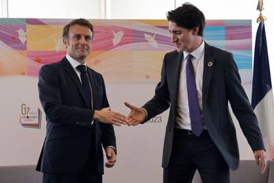 France's President Emmanuel Macron, left, and Canadian Prime Minister Justin Trudeau in Hiroshima. AFP
