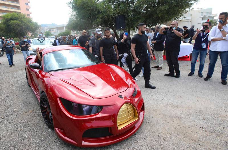 Lebanese-born Palestinian businessman Jihad Mohammad, arrives in the Quds Rise, the first electric car to be produced in Lebanon, during an unveiling ceremony in Khalde, south of the capital Beirut. AFP