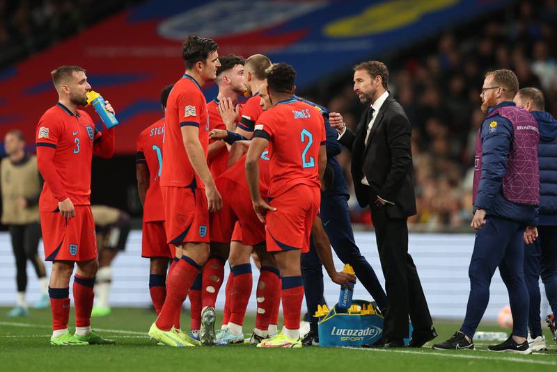 England manager Gareth Southgate talks to his players during a break in play. Action Images
