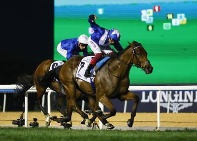 Frankie Dettori riding Lord North on his way to winning the $5 million Dubai Turf. Reuters