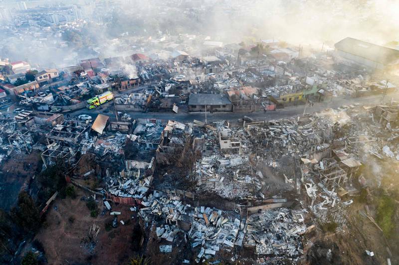 Houses destroyed by a forest fire in a hill district in  Valparaiso region, Chile. AFP
