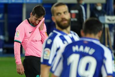 Messi wipes his face. AFP