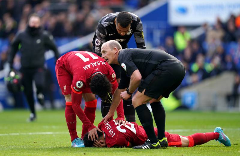 Brighton goalkeeper Robert Sanchez checks on Luis Diaz after colliding with the attacker following Liverpool's opening goal.