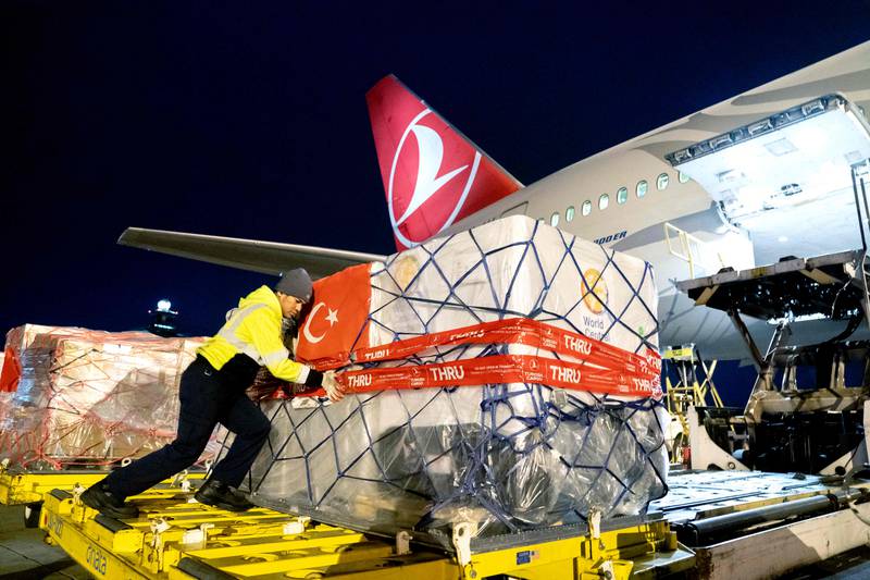 An airline worker loads boxes filled with donations onto a Turkish Airlines aircraft at Dulles International Airport in Dulles, Virginia. AFP