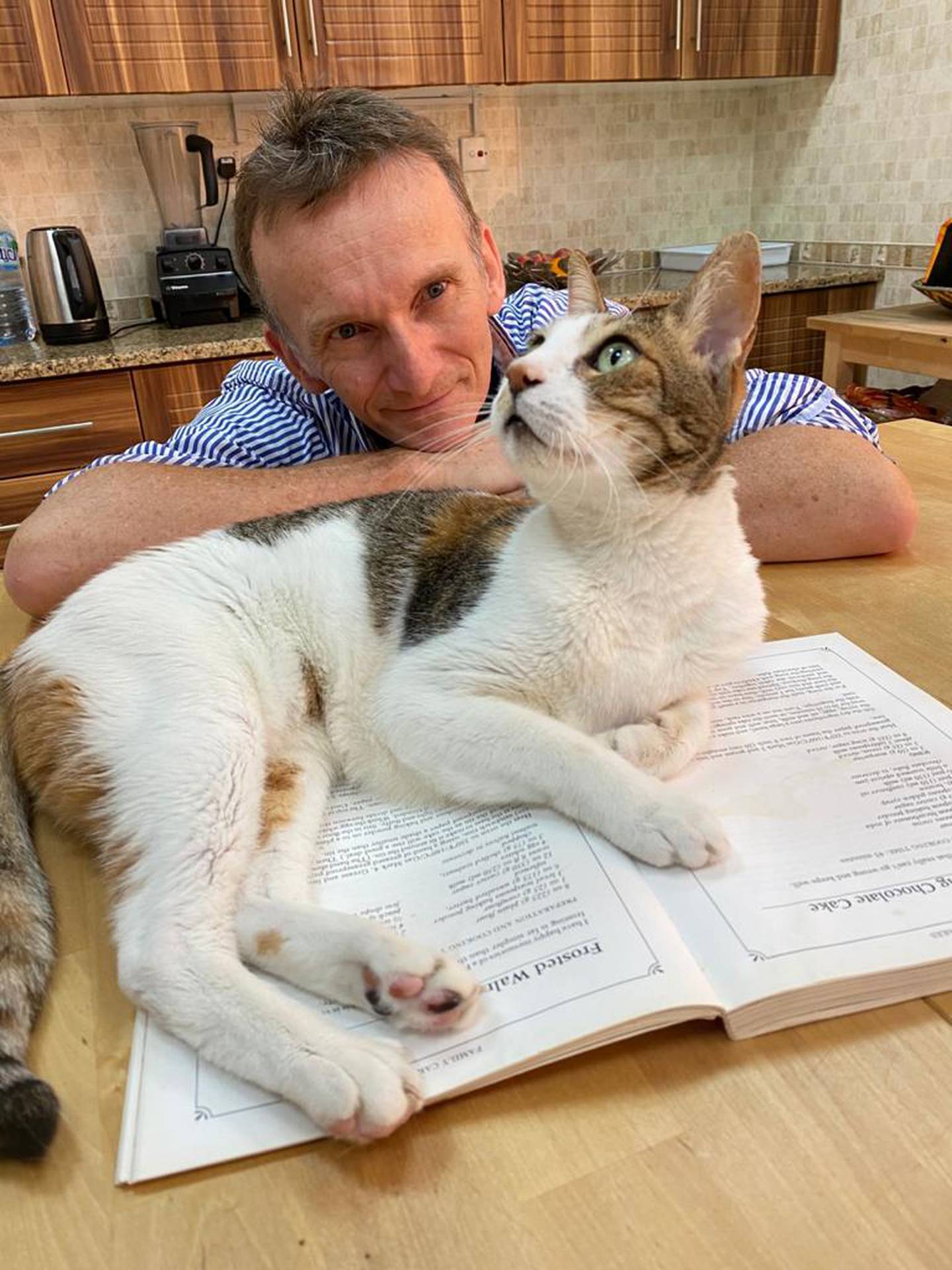 British Veterinary Centre's Dr Martin Wyness and his cat, Ting Tong. Courtesy Martin Wyness