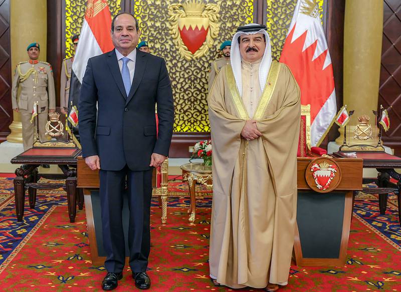 King Hamad and Mr El Sisi in Manama. The Egyptian leader arrived after a trip to Oman. AFP