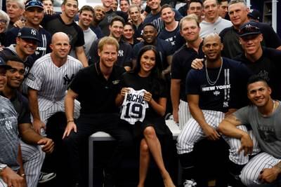 Prince Harry and Meghan pose for a photo with the New York Yankees before their baseball game against the Boston Red Sox at London Stadium in June 2019. Getty