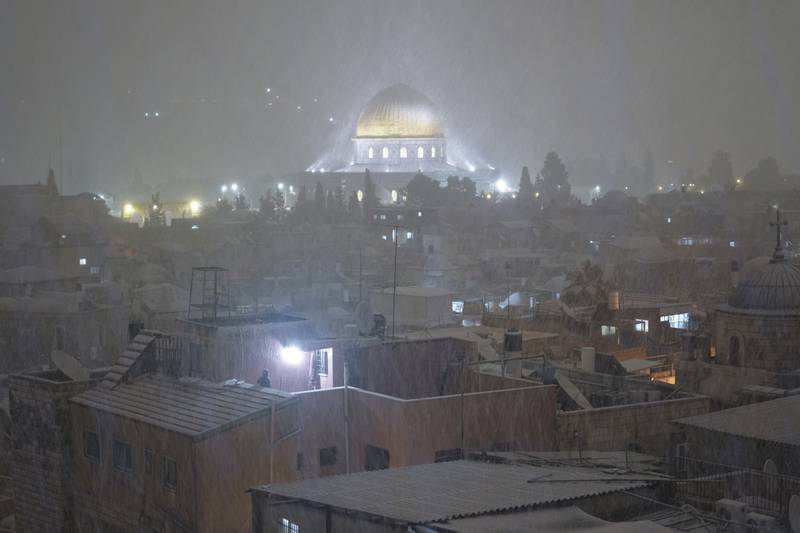 The wintry weather led to poor visibility in the old town. AP