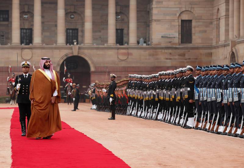 Prince Mohammed inspects a honour guard. Reuters