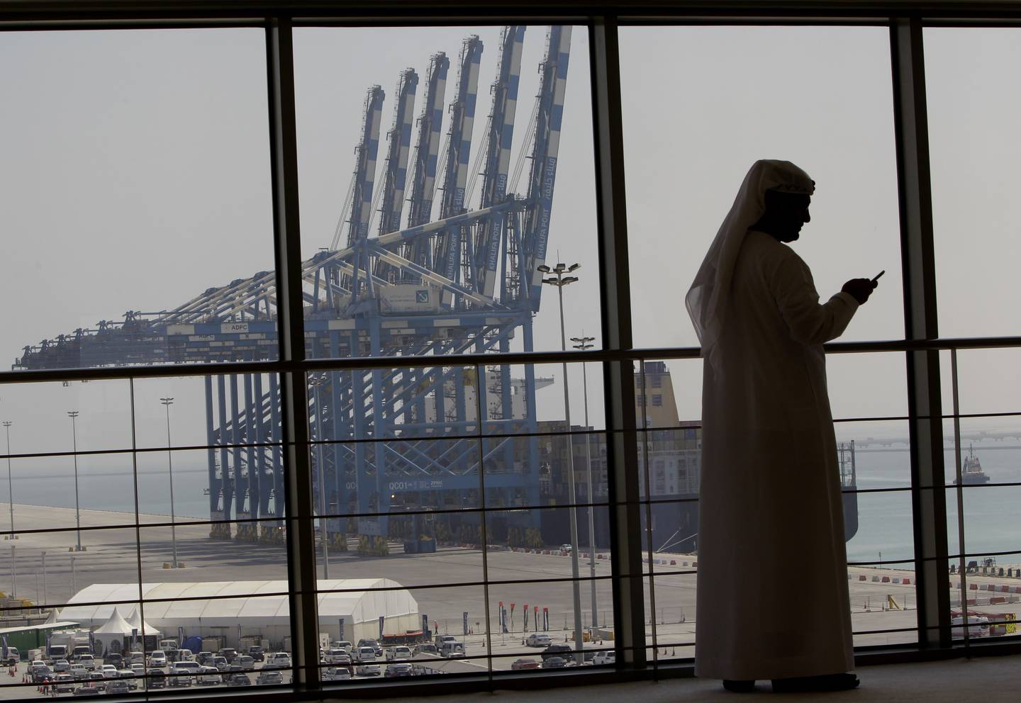 An Emirati official takes part in the opening ceremony of the first phase of the Khalifa port, southwest of Abu Dhabi, United Arab Emirates on September 1, 2012. Abu Dhabi Ports Group began trading for the first time on February  8, 2022 on Abu Dhabi's stock exchange. AP