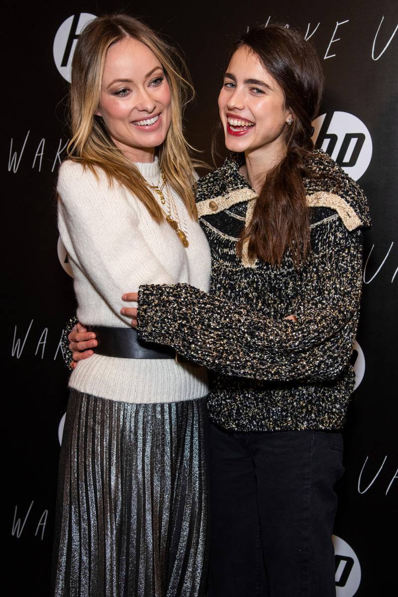 Olivia Wilde, in a metallic skirt and St Roche cream jumper, and Margaret Qualley attend the 'Wake Up' premiere at Chefdance on January 24, 2020 in Park City, Utah.