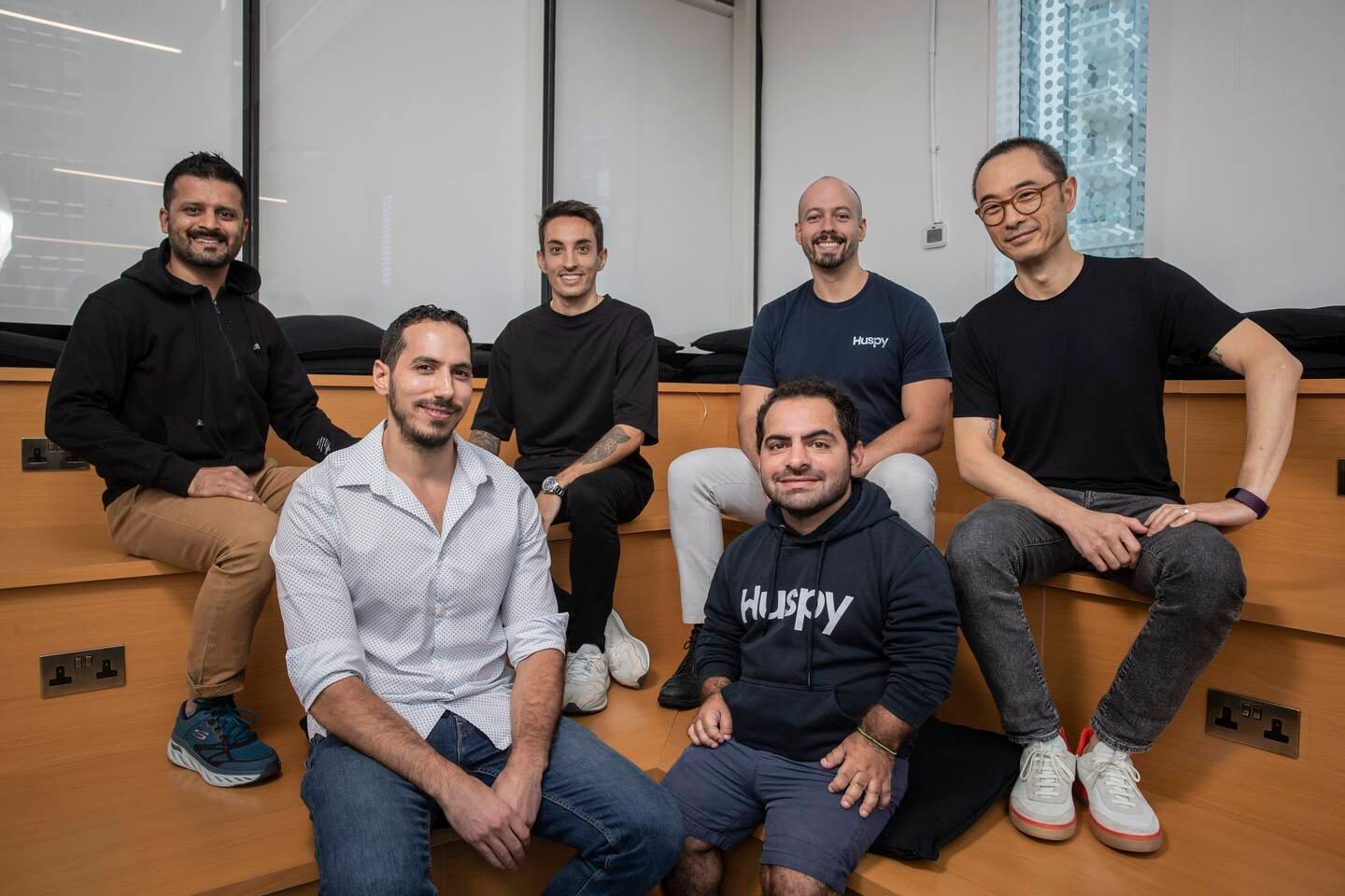 Huspy founders Khalid Ashmawy, front left, and Jad Antoun, front right, with the company's leadership team. Antonie Robertson / The National
