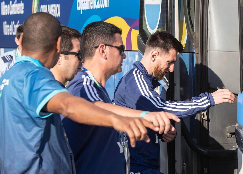 Lionel Messi and teammates board a bus before training. EPA