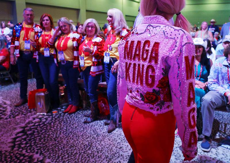 A woman wears a jacket reading 'Maga King' at the Conservative Political Action Conference (CPAC) in Dallas, Texas. Reuters