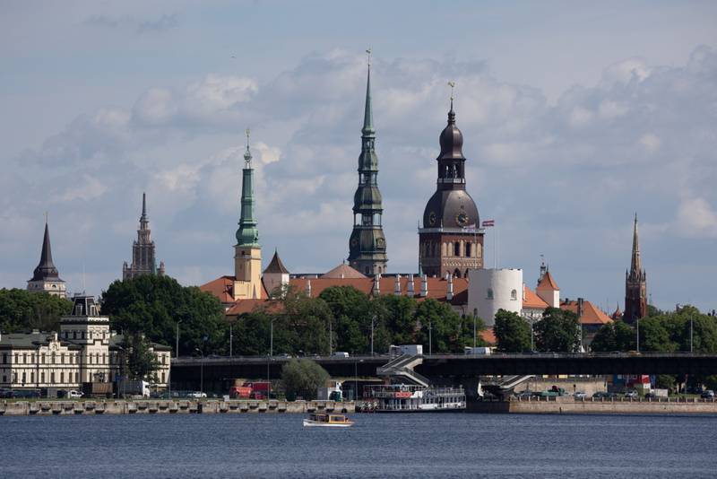 The spires of buildings in the Old Town district, on the Daugava River in Riga. Latvia aims to boost its economy with new privatisation plans. Bloomberg