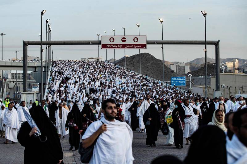Thousands of pilgrims make their way across Mina to perform the stoning of the devil ritual, which marks the start of the Eid Al Adha holiday. AFP