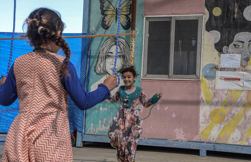Girls skip at the Jadaa rehabilitation camp for the displaced near city of Mosul in northern Iraq.