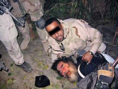 December 13, 2003: Ousted president Saddam Hussein is found by US troops in a cellar south of Tikrit, near his hometown. 'Ladies and gentlemen, we got him,' says  US ambassador Paul Bremer, who was appointed to lead the Coalition Provisional Authority. AFP 