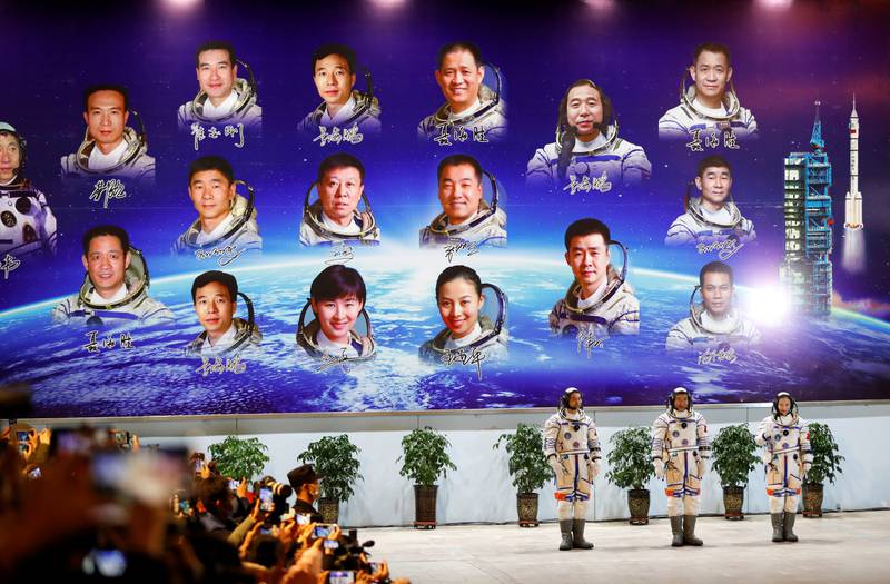 Astronauts Ye Guangfu, Zhai Zhigang and Wang Yaping attend a ceremony ahead of the launch of the Long March-2F Y13 rocket. Reuters