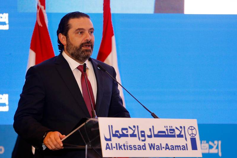 Lebanese Prime Minister Saad Hariri, speaks during the opening session of the Arab Economic Forum in Beirut, Lebanon, Thursday, May 2, 2019. The forum is taking place amid an economic crisis in Lebanon, which is suffering from slow growth, a high budget deficit and massive debt. The Lebanese government is holding open-ended sessions to discuss to approve the country's draft austerity budget. (AP Photo/Bilal Hussein)