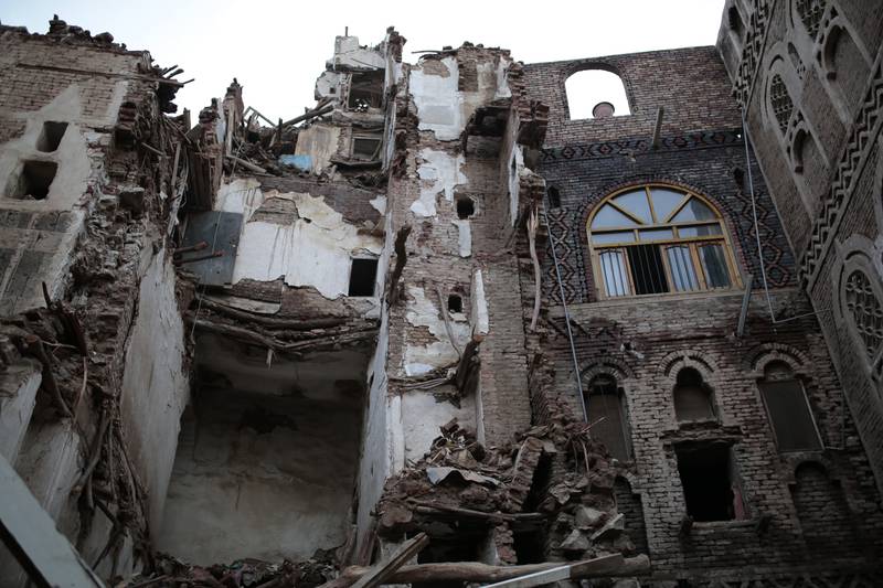 The remains of damaged buildings in the Yemeni capital. AP