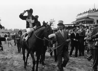 Racehorse Mill Reef, ridden by jockey Geoff Lewis, being led away by his owner Paul Mellon after his victory at the Derby at Epsom, England, June 2nd 1971. (Photo by Dennis Oulds/Central Press/Getty Images)