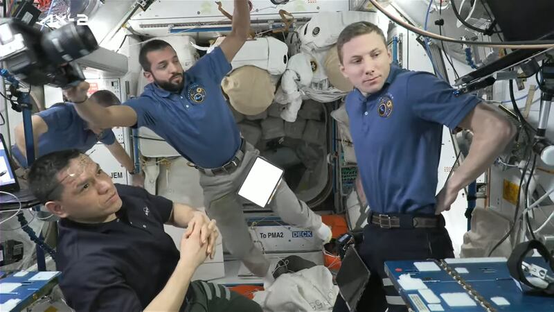 Mr Al Neyadi, centre, prepares to welcome the two Saudi astronauts aboard the ISS