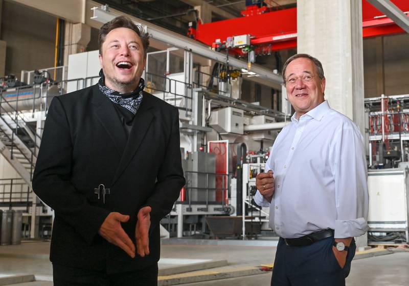 Mr Musk with Armin Laschet, at the time CDU party federal chairman and prime minister of Germany's North Rhine-Westphalia, at the Tesla Gigafactory in Gruenheide, in 2021 Getty 