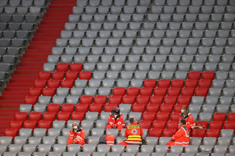 Medics wait in the stands as play resumes behind closed doors following the outbreak of the coronavirus. Reuters