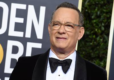 FILE - In this Jan. 5, 2020 file photo, Tom Hanks arrives at the 77th annual Golden Globe Awards at the Beverly Hilton Hotel in Beverly Hills, Calif. For the first time in its lengthy history, â€˜Saturday Night Liveâ€™ held an all-quarantine version, which aired Saturday, April 11 with stars delivering taped material primarily from their homes. Coronavirus pioneer Hanks was the guest host, with Chris Martin the musical guest and cameos from Larry David portraying Bernie Sanders and Alec Baldwin as President Donald Trump.  (Photo by Jordan Strauss/Invision/AP, File)