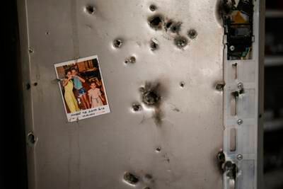 A bullet-riddled fridge in a house in the kibbutz of Kissufim in southern Israel, where 14 people were killed and four were abducted by Hamas militants on October 7. AP
