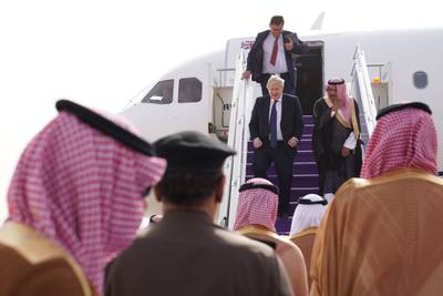 Boris Johnson walks down the steps of his plane as he arrives at Riyadh Airport, Saudi Arabia