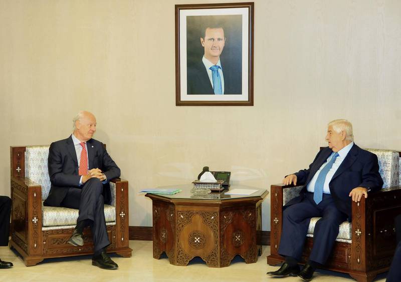 epa07116055 A handout photo made available by Syria]s Arab News Agency (SANA) shows Syrian Foreign Minister Walid al-Moallem (R)meeting with the UN Special Envoy for Syria Staffan de Mistura (L) and the accompanying delegation in Damascus, Syria, 24 October 2018. According to Sana, al-Moallem affirmed that Syria continues to support efforts for reaching a political solution for the crisis, noting that Syria has dealt positively with the output of the intra-Syrian national dialogue conference in Sochi and the formation of a committee to discuss the constitution.  EPA/SANA HANDOUT  HANDOUT EDITORIAL USE ONLY/NO SALES