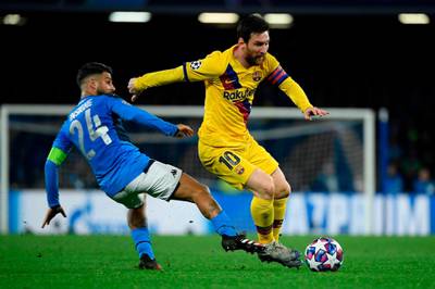 Lionel Messi dribbles past Napoli's Italian forward Lorenzo Insigne. AFP