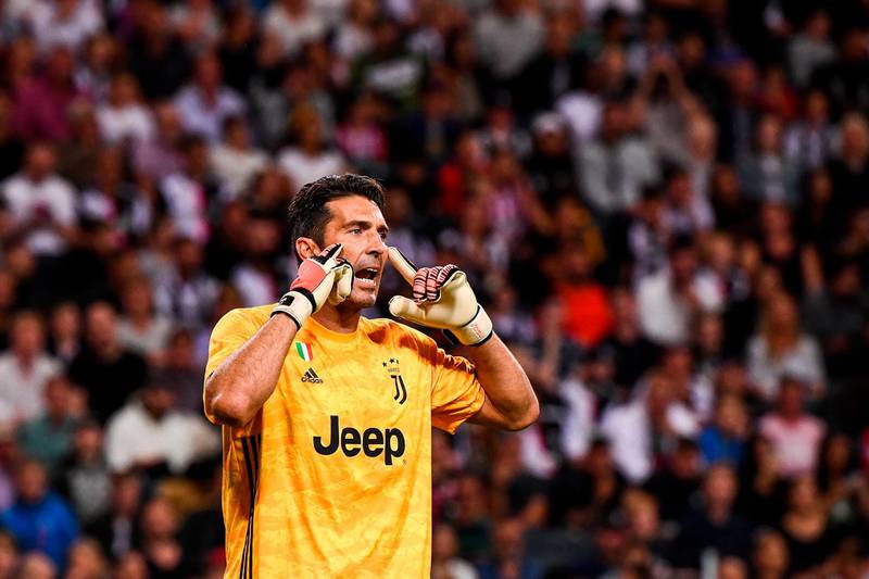 Juventus' goalkeeper Gianluigi Buffon gestures to his teammates. AFP