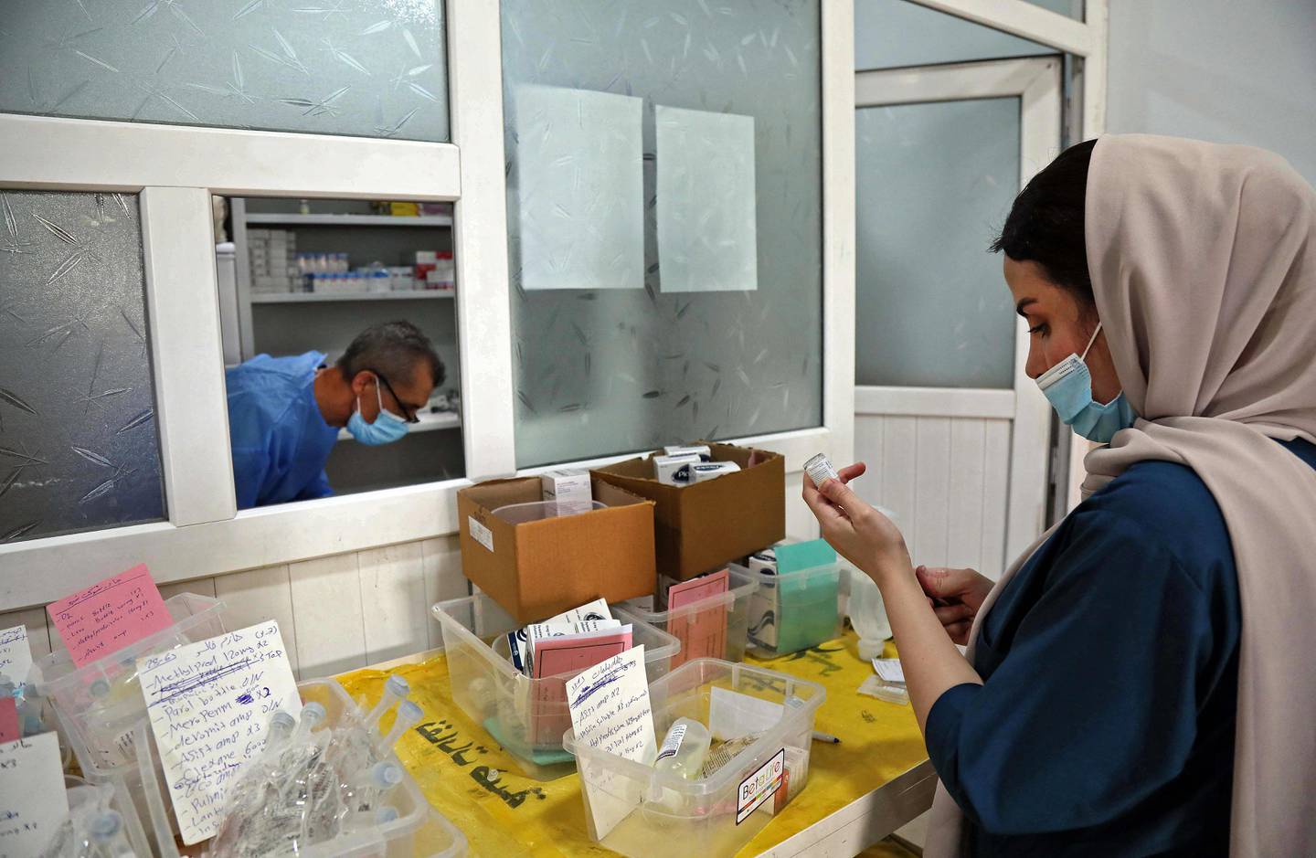 An Iraqi medic sorts through supplies at a hospital in Dohuk. AFP
