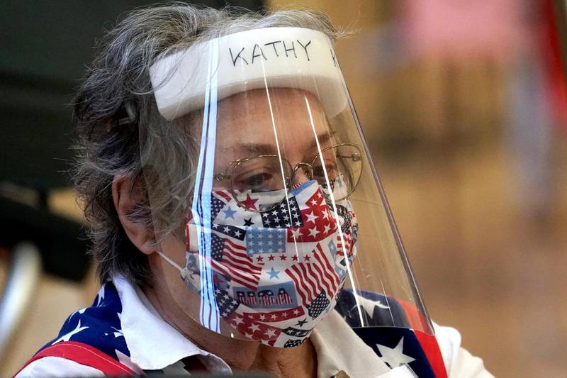 Harris County election clerk Kathy Kellen wears a mask and face shield while working at a polling site in Houston, Texas this week. AP Photo