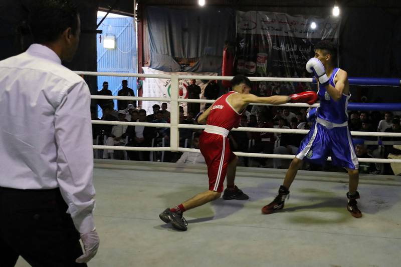 A boxing match in Tripoli. Libya's previous regime considered boxing too violent but, since the 2011 revolution, the country's fighters have shone in various competitions. Many are modelling themselves after Malik Zinad, a light heavyweight boxer who found success after leaving the country for Europe. All photos: AFP