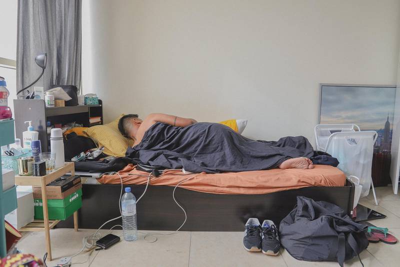 ‘How to Slouch When Sleeping’ is a selfportrait by Augustine Paredes in his bed-space. Courtesy Gulf Photo Plus