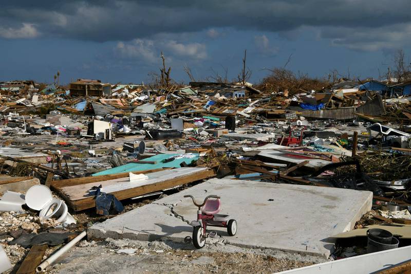 FILE PHOTO: A child's bicycle is seen in a destroyed neighborhood in the wake of Hurricane Dorian in Marsh Harbour, Great Abaco, Bahamas, September 7, 2019.  REUTERS/Loren Elliott/File Photo