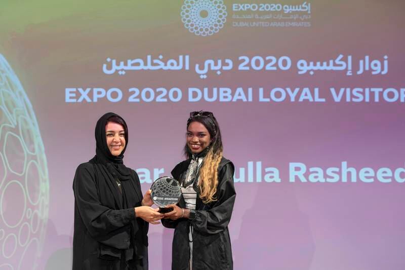 Sudanese pianist Sahar Abdulla Rasheed receives her award from Reem Al Hashimy at the Expo Champions Awards ceremony at Opportunity Forum. Photo: Expo 2020 Dubai