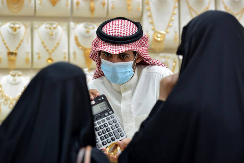 Saudis shop at a jewellery shop in the Tiba gold market in the capital Riyadh.   AFP