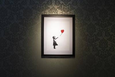 epa07273894 An artwork by anonymous British street artist Banksy is on display during the opening of the exhibition 'PUNK: Raw Power - The Revolt Against Innocent' in Zurich, Switzerland, 10 January 2019.  EPA-EFE/ENNIO LEANZA