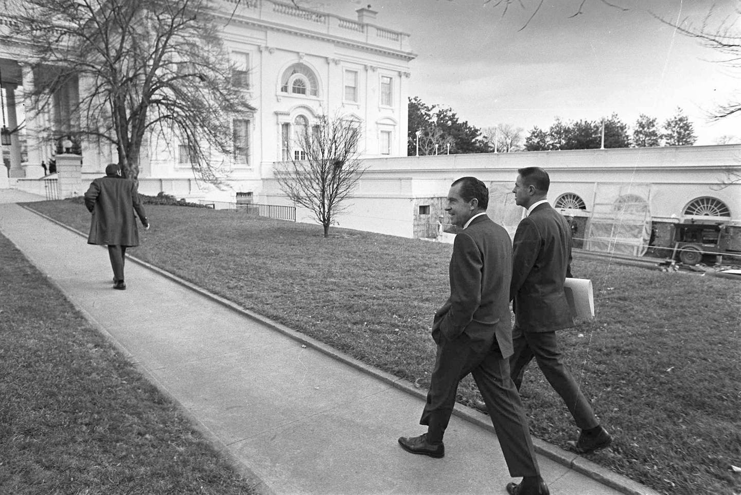 Former US President Richard Nixon walks with his assistant H R  Haldeman from the Executive Office Building to the White House for a Cabinet meeting, on December 19, 1969, in Washington. AP