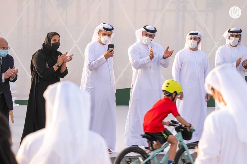 Spectators cheer on cyclists at a ceremony naming Abu Dhabi as Asia’s first Bike City.